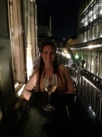 Notice my wine and glass are sitting at an angle? I'm leaning towards the building to keep from falling off the balcony!